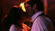 Lois and Clark share a passionate kiss and reaffirm their love.
