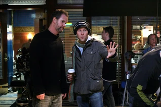 Director of Photography Glen Winter discusses a shot with episode director Michael Rosenbaum on season six's episode Freak