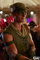 Oliver Queen dressed as Robin Hood.
