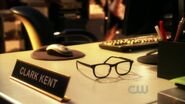 In his dream, Clark leaves his glasses on his desk in Salvation.