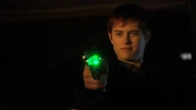 Alexander holds Clark down at gunpoint