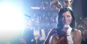 Lois seductively flirting with Ray Sacks in her "bunny" costume.