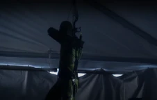Green Arrow on the rescue mission, infiltrating Tess's Arctic base 