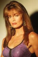 Tracy Scoggins as Cat Grant in Lois & Clark: The New Adventures of Superman.