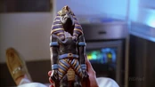 The Crystal of Fire vessel: an ancient statue of the Egyptian god of Wisdom .