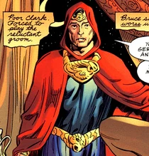 Superman wearing his cape with a hood.