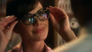Lois wearing Clark's glasses in Idol.