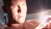 Lex holds the Crystal of Fire.
