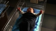 Unknown Actor as infant Leonard Snart in DC's Legends of Tomorrow (2016)