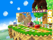 Kirby est sur le point d'avaler une Pomme venant du stage Vertes Prairies dans Super Smash Bros. Brawl