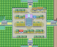 Safrania dans Pokémon Rouge Feu et Vert Feuille. Le grand bâtiment central s'appelle le "Sylphe SARL".