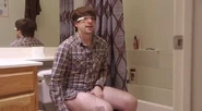 Ian wearing google glasses while pooping