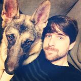 Ian with his and Melanie's German Shepherd dog, Daisy.