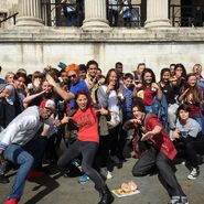 Lasercorn, Mari, Flitz and Wes with a crowd of fans in Trafalgar Square, London