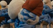 Papa Smurf shows how proud he is of Clumsy at the end of the film.