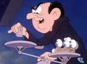 Gargemel weighing the smurfs