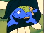 Wild Smurf tries to get out of Gargamel's leaf sandwich.