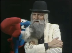 Father Abraham with a Papa Smurf puppet