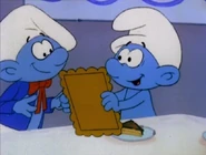 Painter Smurf's hat tilts to the left and is longer than most Smurf hats.