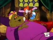 Acorn tickle begin to King Bullrush's face with feather.