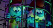 Papa Smurf and Smurfwillow in a cage