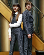 Violet and Klaus in pinstripes.