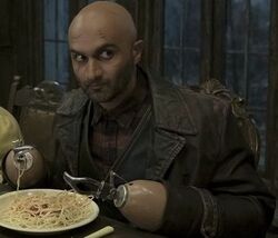 Fernald eating pasta with Olaf's troupe.