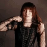 Violet tying her hair.