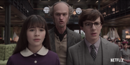 Count Olaf, Violet and Klaus in Court.