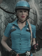 Officer Luciana beside Fowl Fountain.