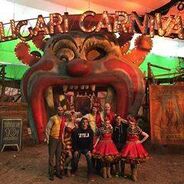 Cast posing at the entrance in front of the Caligari Carnival