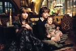 The Baudelaire children listen to Uncle Monty.