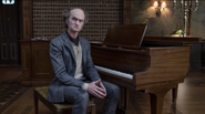 Count Olaf with a piano during the trial.