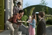 Mr. Poe introducing the Baudelaires to Monty.