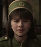 Violet as a Hotel Denouement concierge.