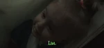 Hiding under a doctors coat.
