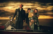Count Olaf and the Baudelaires on a sail boat on Lake Lachrymose.