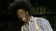 Eddie Murphy as his character Buckwheat.