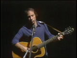 Paul Simon performing "Bridge Over Trouble Water".