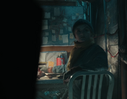 Ruth writing in the notebook