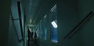 Bess Till (Mickey Sumner), Osweiller (Sam Otto) and Sasha Frolova in the passageway outside the Nightcar