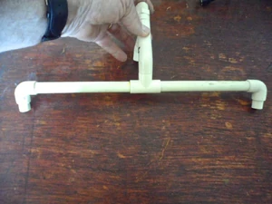 The top 1/2" CPVC cross bar piece is 15 1/2" across for the 35" diameter hoop and has the wooden dowel piece inserted.  The smaller 25" diameter hoop has a cross bar of 10 1/2" across