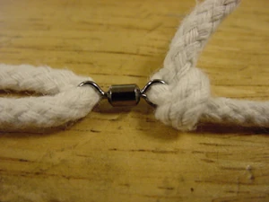 a swivel tied to one end of the top string