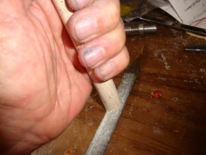 Use a section of 1/2" CPVC tubing, rubbing one end on a 1/2" half-rounf medium course file
