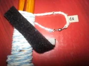 I use a small masking tape tab to mark the size of the top string in inches and also use a no. 2 or 3 1" swivel at the center of my bottom (sling) string. (Rick Findley)