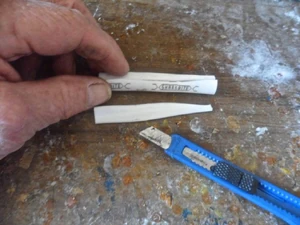 Cut off a 3-4" piece of 1/2" PEX tubing and slice out a section longways to make the diameter smaller.