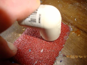 
Rub each end of the elbow fitting you have sleeved onto some course sandpaper until flush