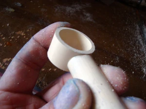 Put this piece to the other piece you cut to see if you have a flush contact (as shown). Continue filing until you do