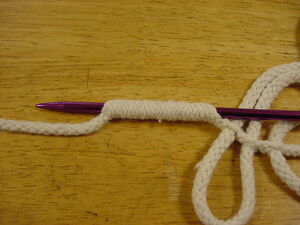 Fid inserted into the center of the hollow braid