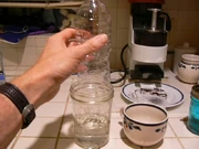 Sliding the bottle into the jar causes a bubble to be formed